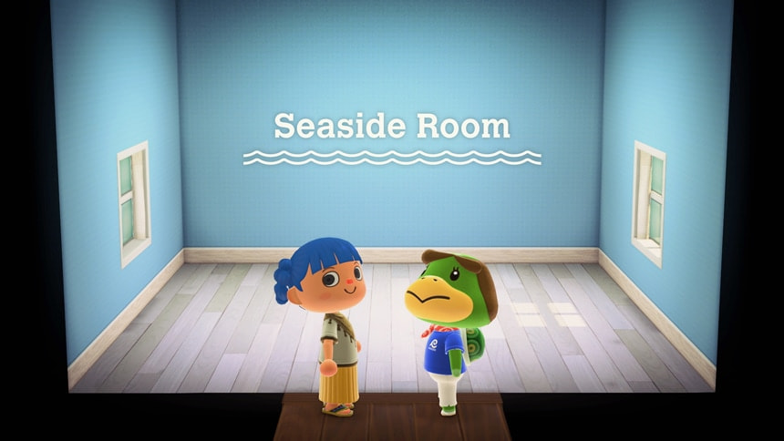 Player and Kapp'n stand in an empty room with blue walls and white flooring called the Seaside Room.
